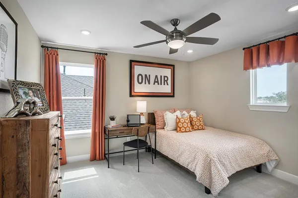 a bedroom with a large bed and a window