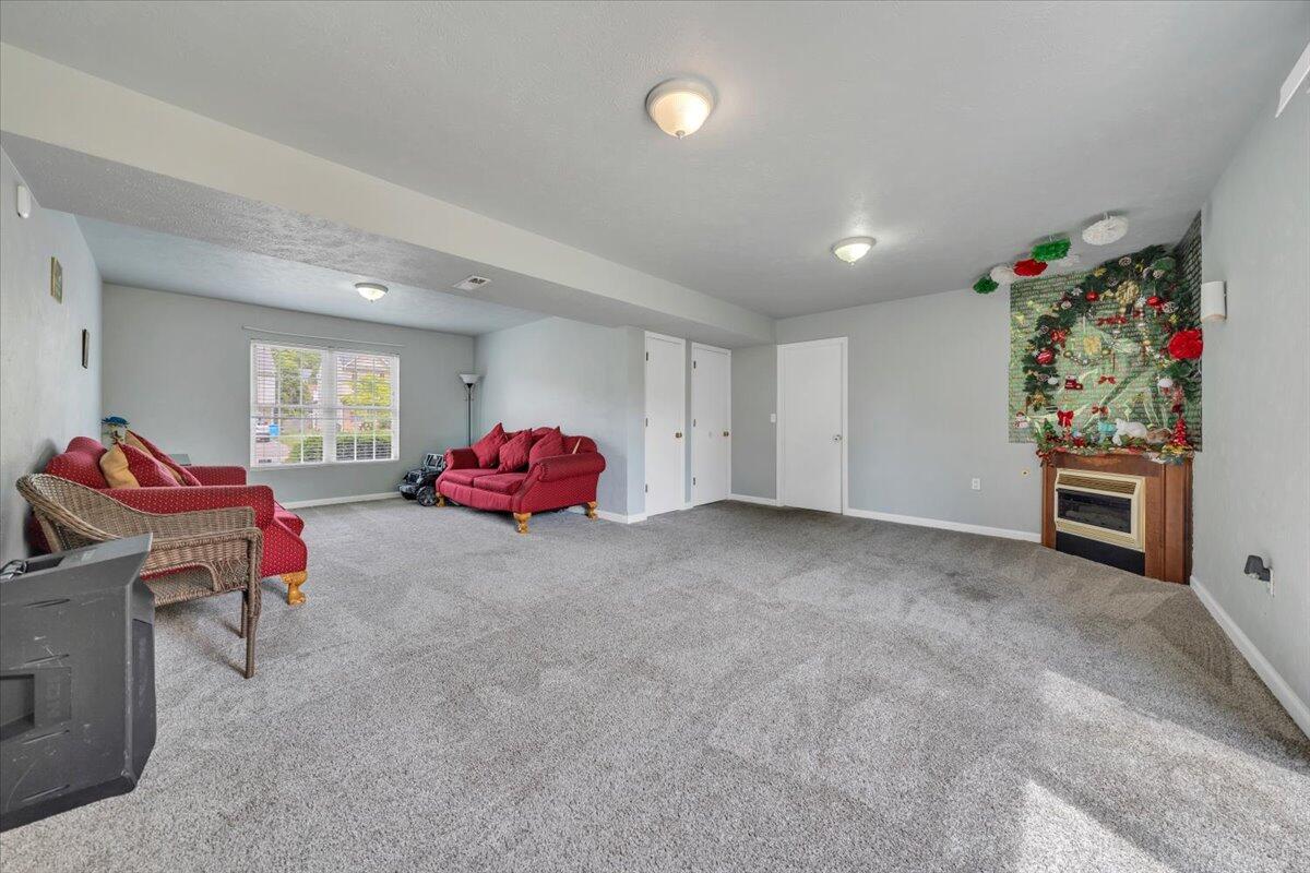 4751 Westvale Road Northeast Roanoke, VA 24019 - Photo 20 of 30 a living room with furniture and a flat screen tv