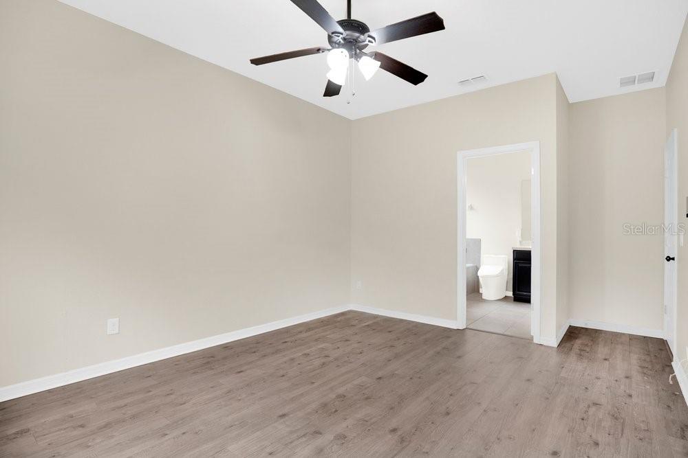680 Preakness Circle Deland, FL 32724 - Photo 11 of 28 wooden floor in an empty room