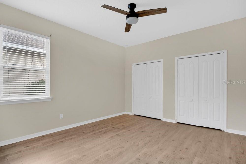680 Preakness Circle Deland, FL 32724 - Photo 15 of 28 a view of a room with a ceiling fan and window