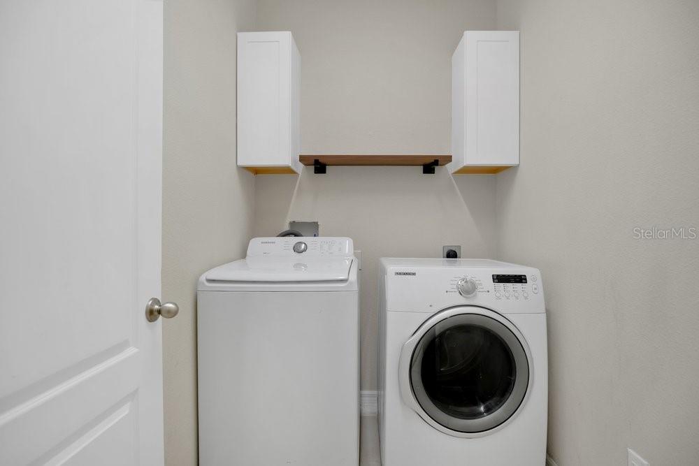 680 Preakness Circle Deland, FL 32724 - Photo 20 of 28 a utility room with dryer and washer