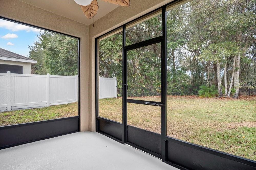 680 Preakness Circle Deland, FL 32724 - Photo 22 of 28 a view of a room and trees in the background