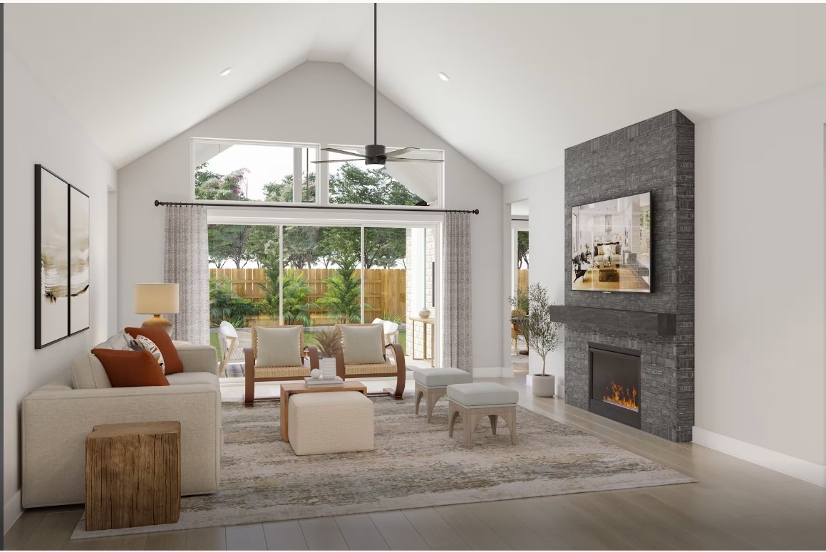 2627 Goodman Ridge Drive Rosharon, TX 77583 - Photo 5 of 12 a living room with furniture a large window and a fireplace
