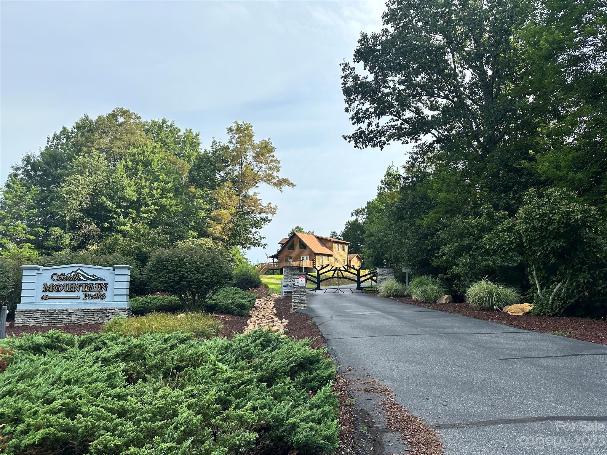 643 Woodgate Drive, Unit 40 Bostic, NC 28018 - Photo 16 of 17 a view of a park that has large trees