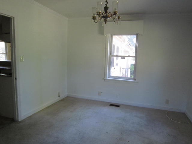 2552 Anderson Drive Macon, GA 31206 - Photo 3 of 12 an empty room with windows and fan