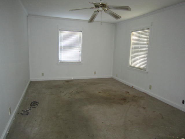 2552 Anderson Drive Macon, GA 31206 - Photo 7 of 12 an empty room with windows and fan