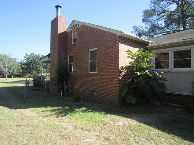 2552 Anderson Drive Macon, GA 31206 - Photo 10 of 12 a backyard of a house with lots of green space
