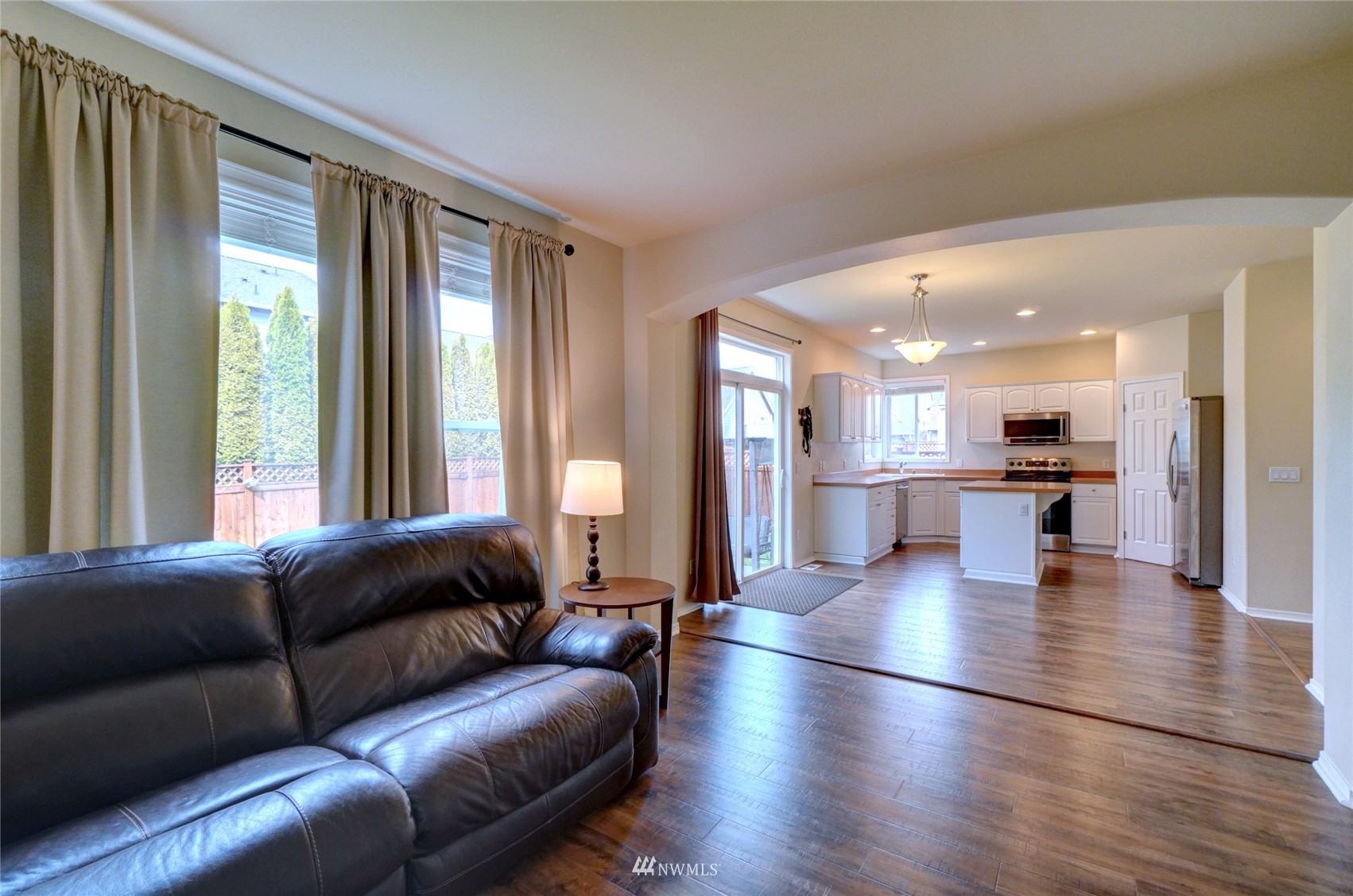 7053 Radius Loop Southeast Lacey, WA 98513 - Photo 14 of 34 a living room with furniture and a large window