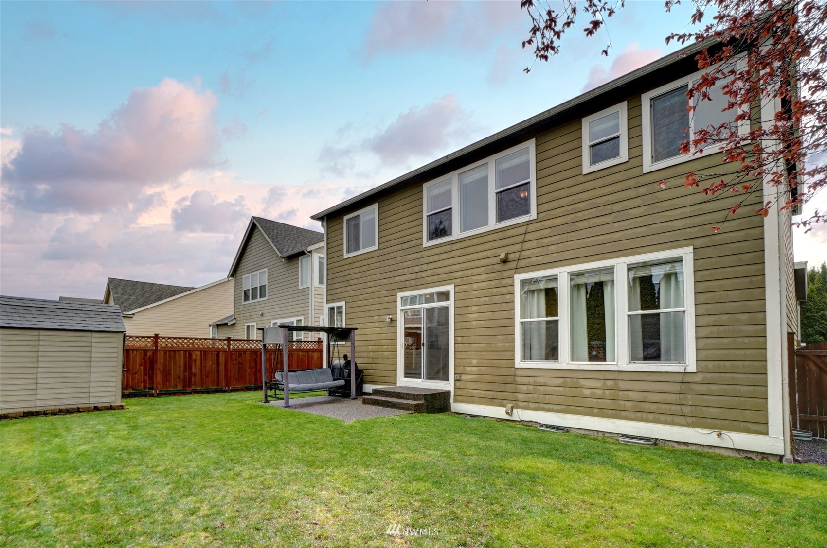 7053 Radius Loop Southeast Lacey, WA 98513 - Photo 20 of 34 a view of a house with a backyard