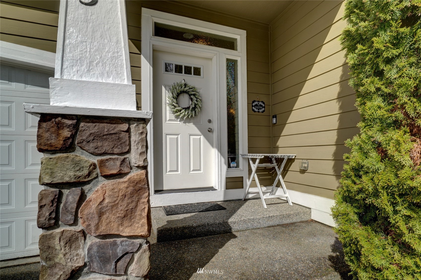 7053 Radius Loop Southeast Lacey, WA 98513 - Photo 2 of 34 a front view of a house with entryway