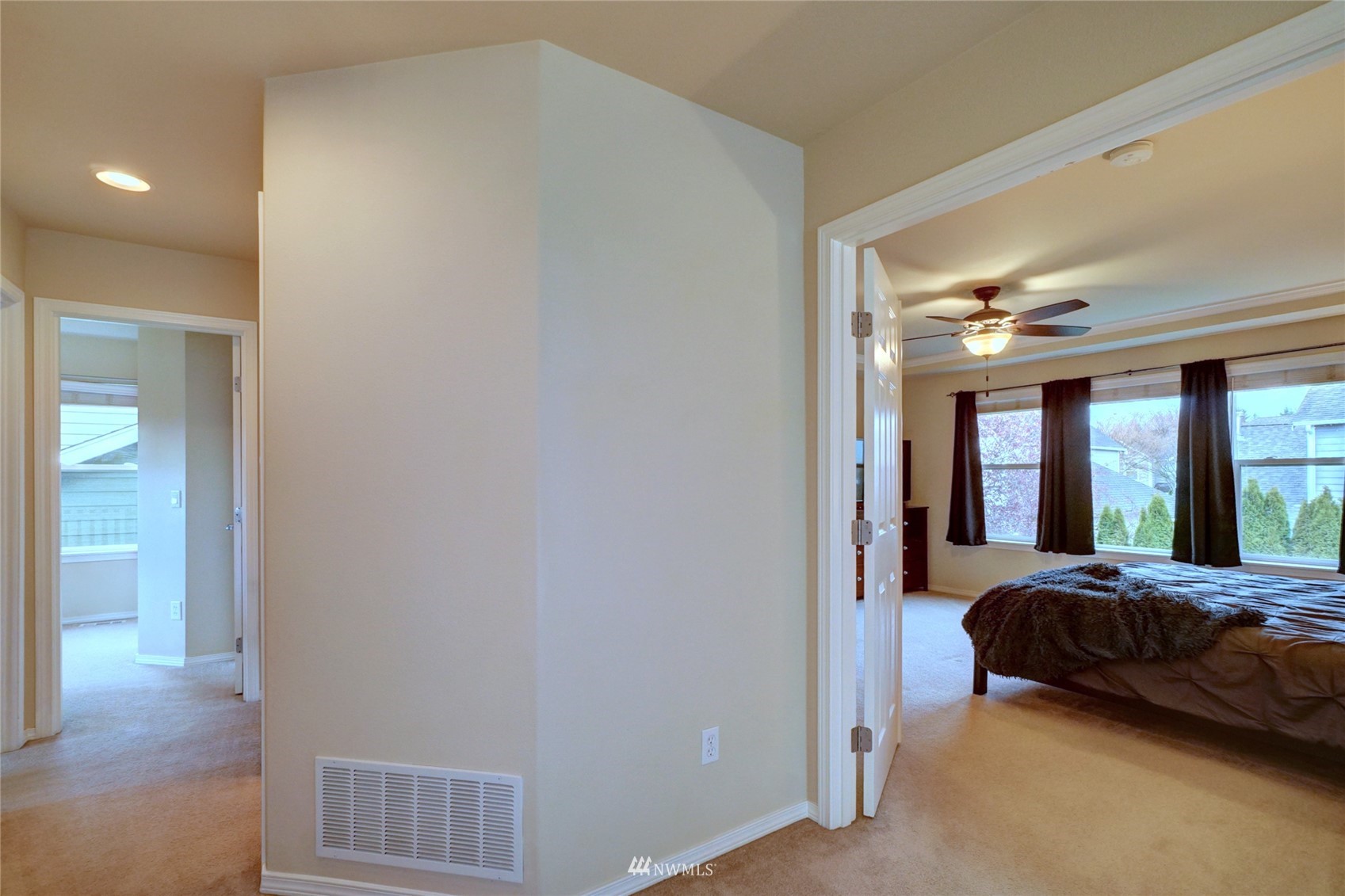 7053 Radius Loop Southeast Lacey, WA 98513 - Photo 22 of 34 a bedroom with a bed and a large window