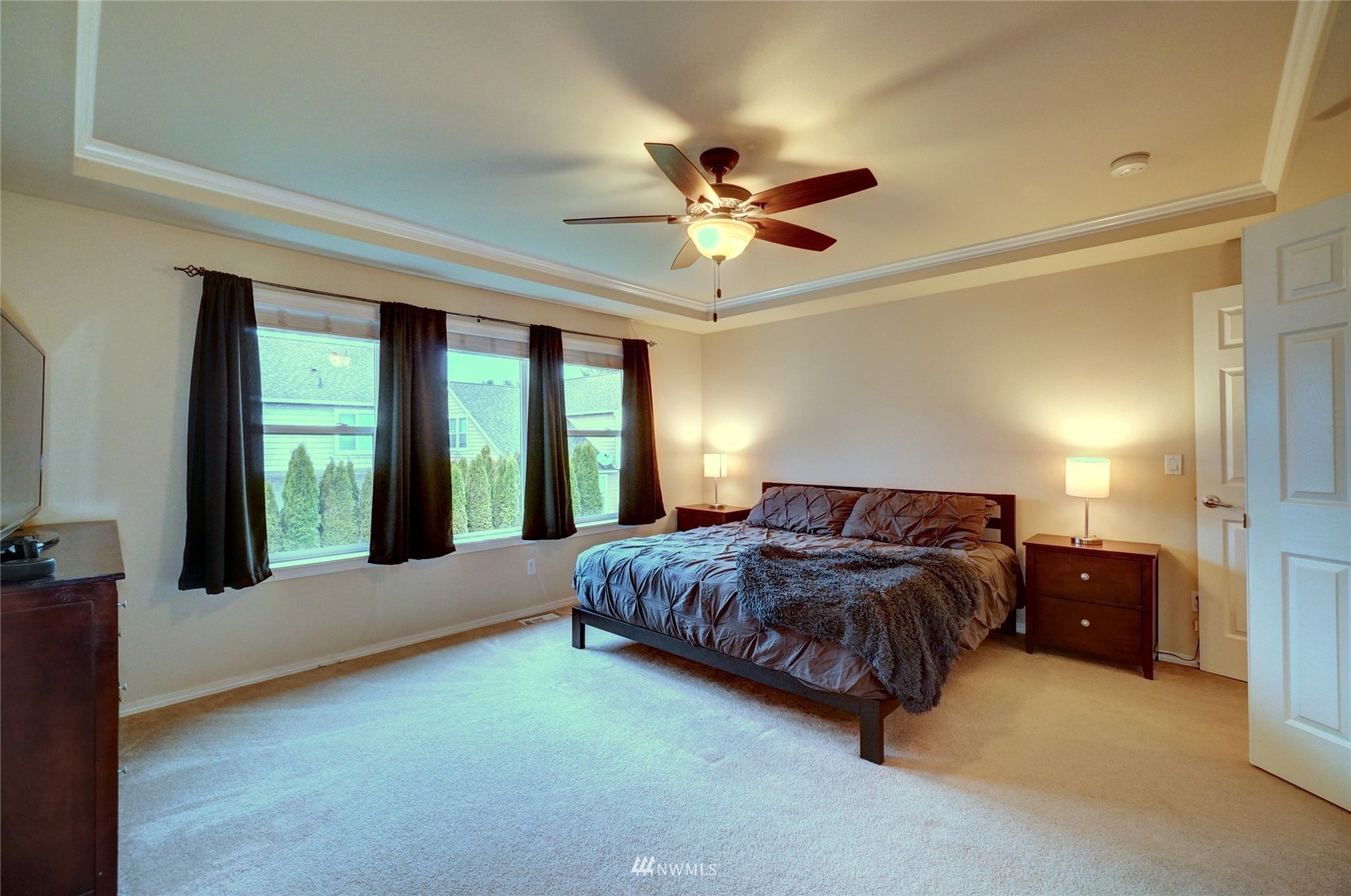 7053 Radius Loop Southeast Lacey, WA 98513 - Photo 23 of 34 a spacious bedroom with a bed and a large window