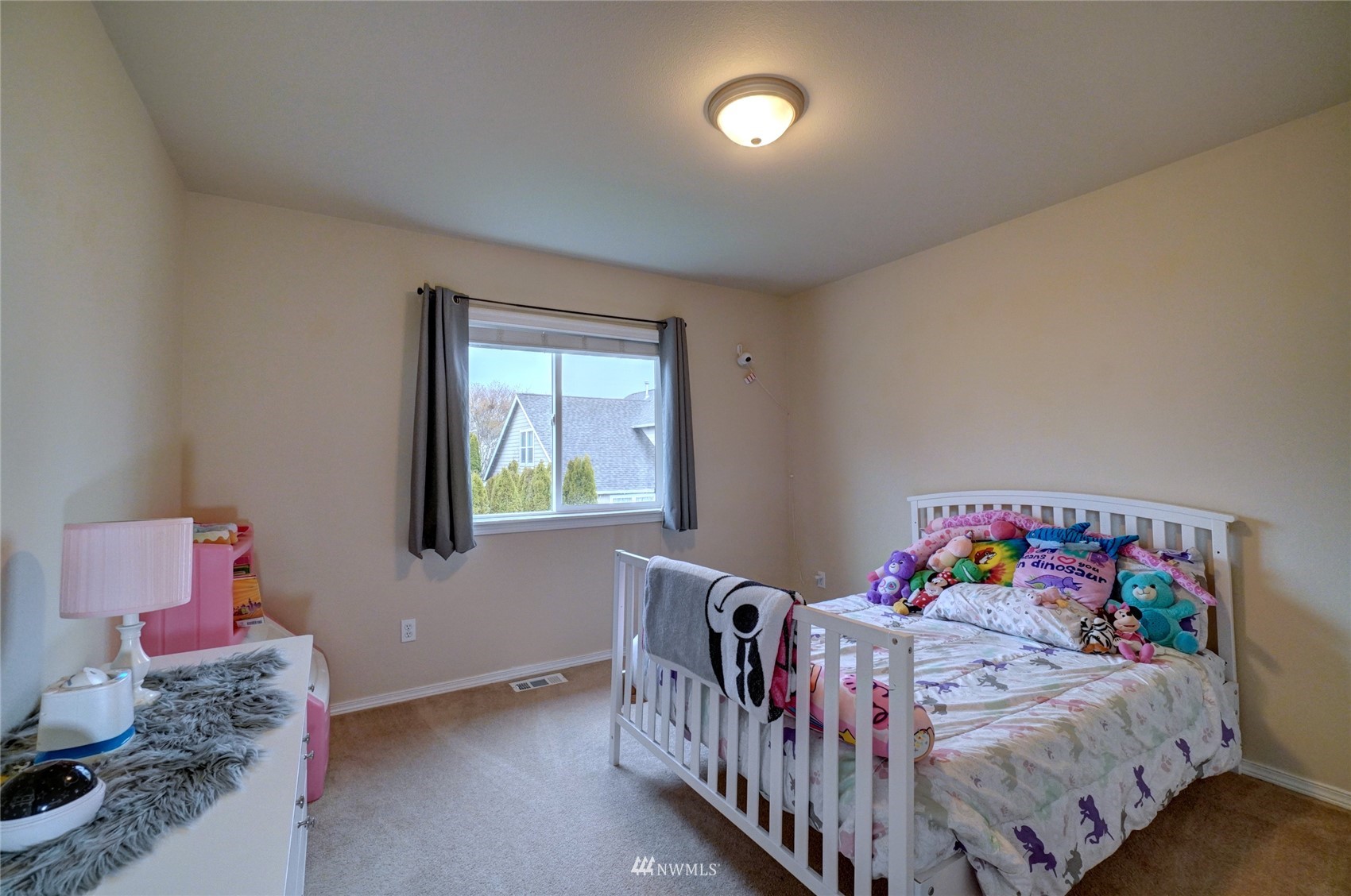 7053 Radius Loop Southeast Lacey, WA 98513 - Photo 27 of 34 a bedroom with a bed and a window