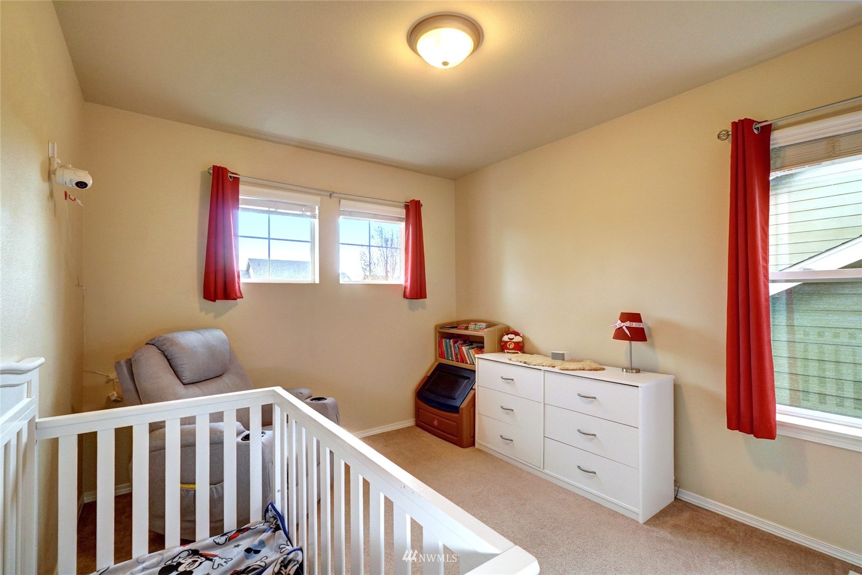 7053 Radius Loop Southeast Lacey, WA 98513 - Photo 31 of 34 a bedroom with a bed and a window