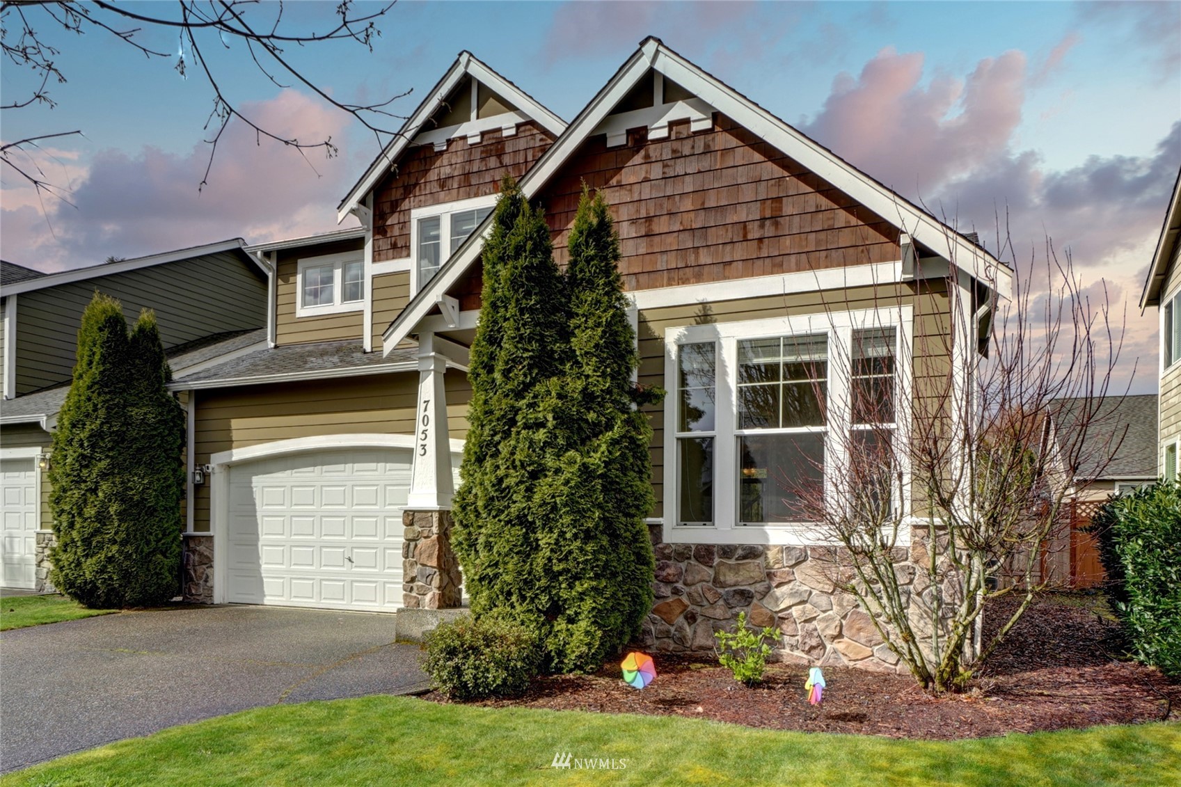 7053 Radius Loop Southeast Lacey, WA 98513 - Photo 34 of 34 a front view of a house with garden