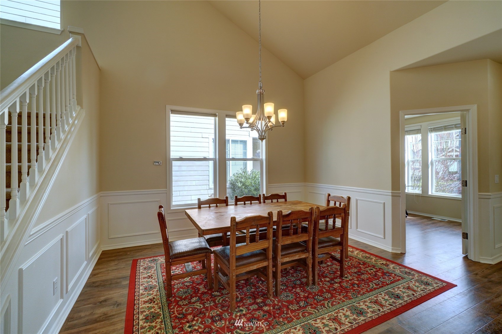 7053 Radius Loop Southeast Lacey, WA 98513 - Photo 5 of 34 a view of a dining room with furniture and wooden floor