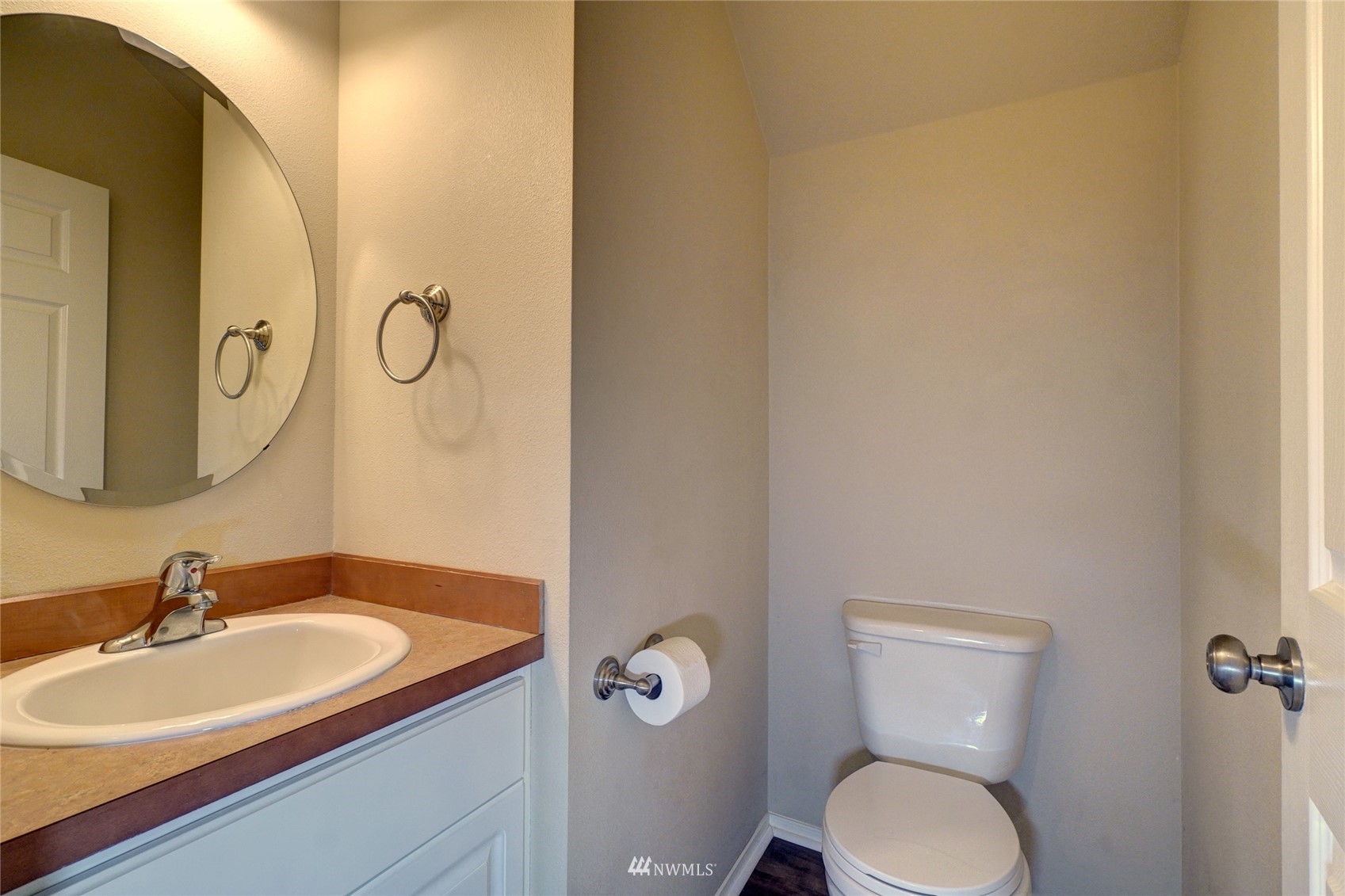 7053 Radius Loop Southeast Lacey, WA 98513 - Photo 7 of 34 a bathroom with a granite countertop sink and a mirror