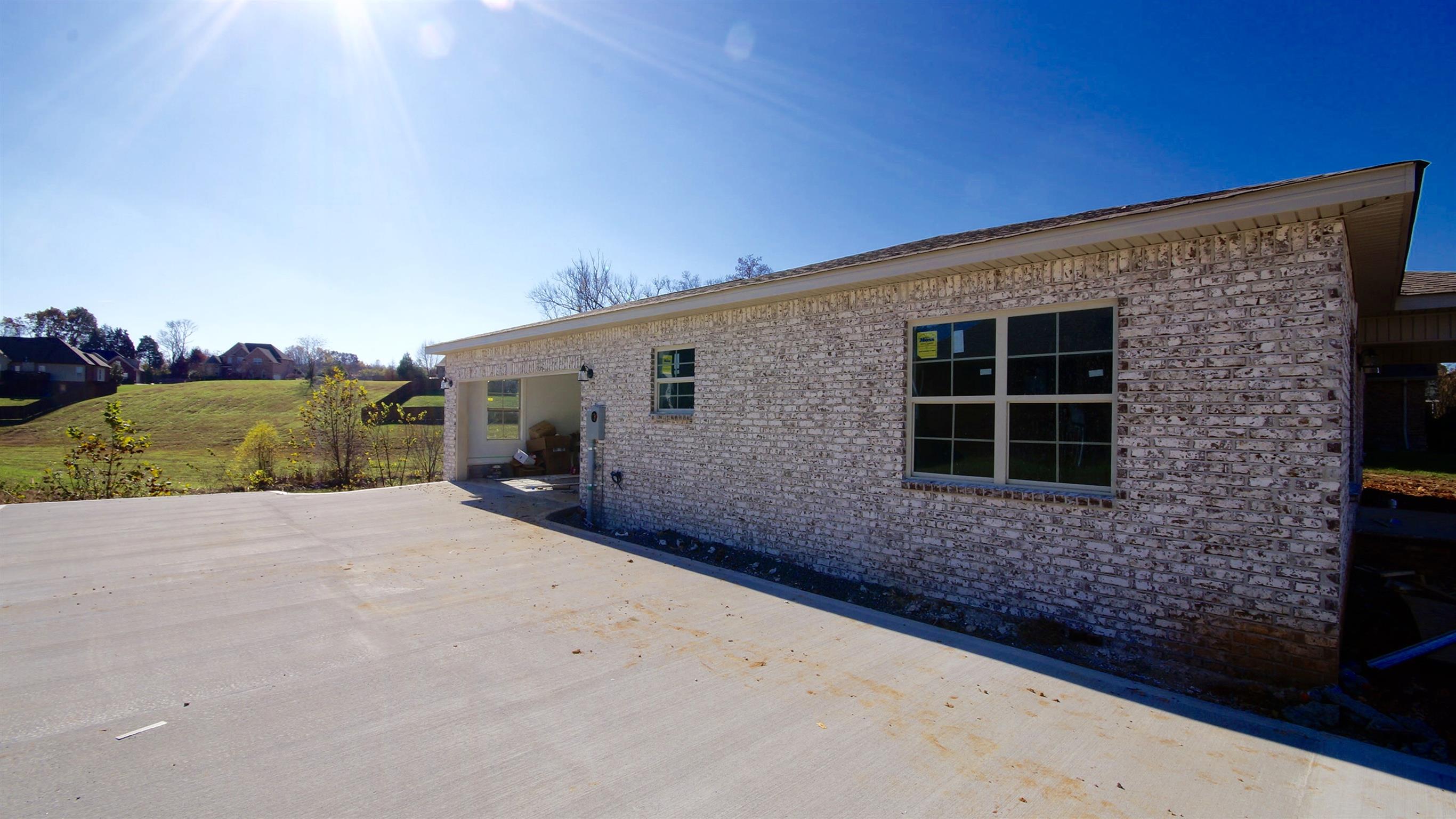 3568 Drake Road Adams, TN 37010 - Photo 2 of 6 a view of a house with a backyard