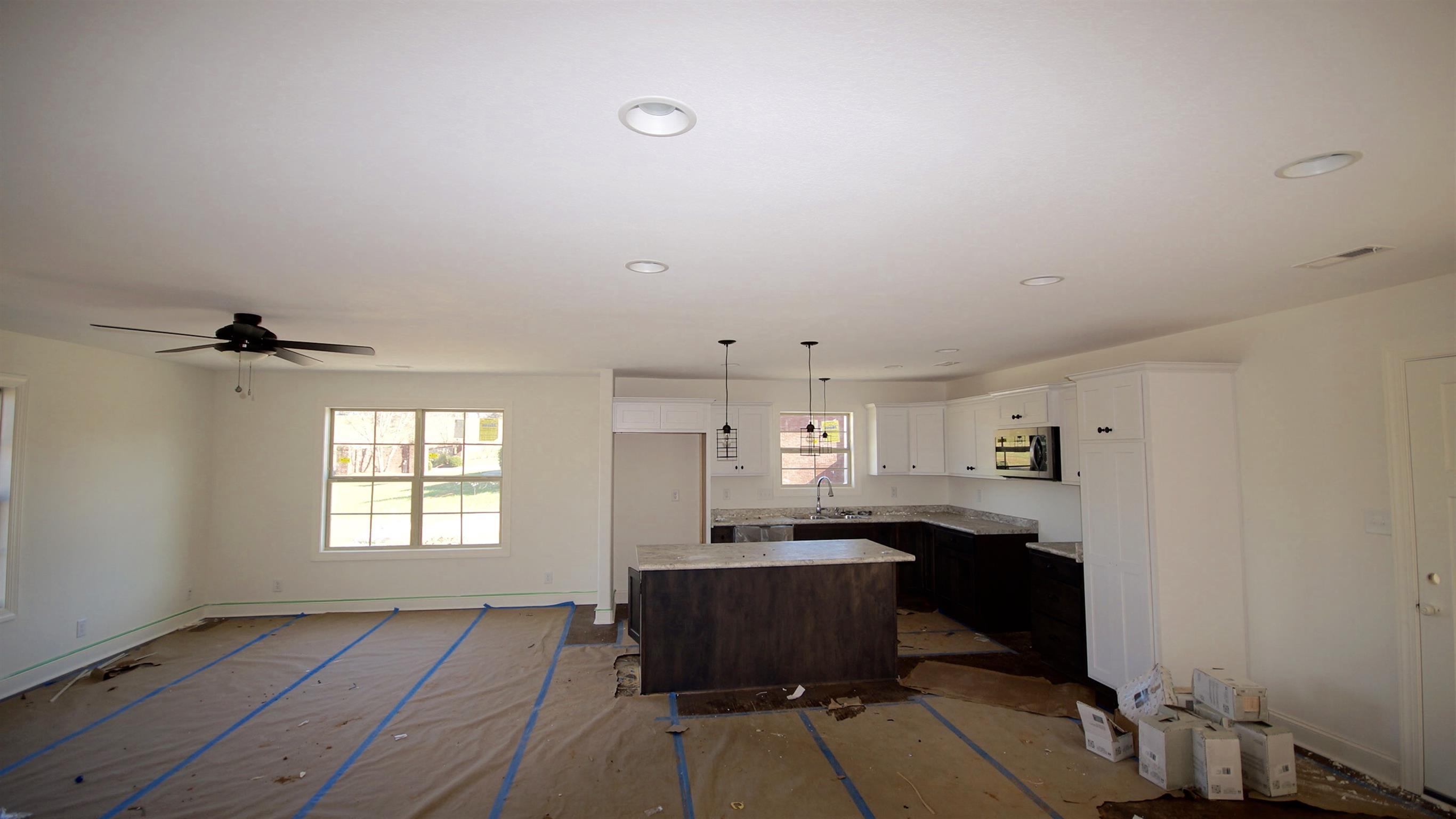3568 Drake Road Adams, TN 37010 - Photo 4 of 6 a view of workspace with wooden floor and windows