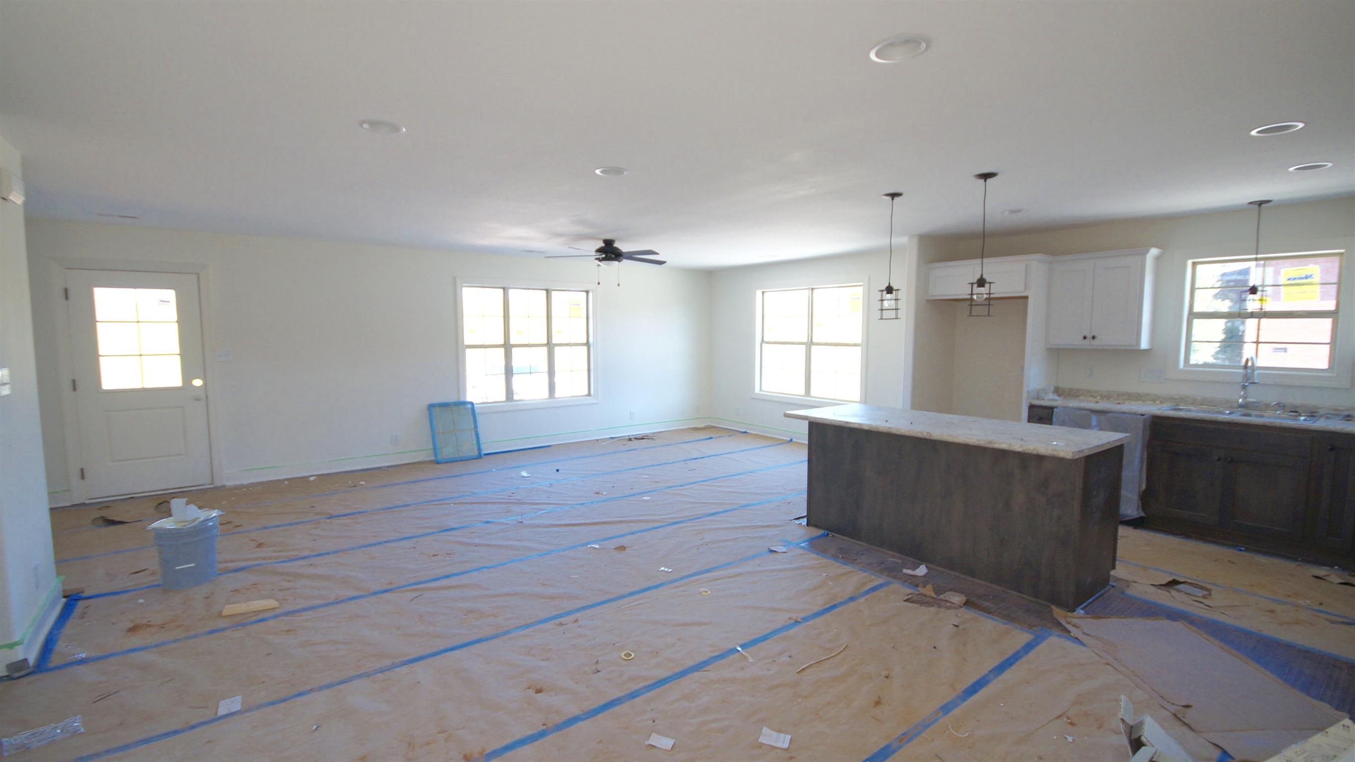 3568 Drake Road Adams, TN 37010 - Photo 6 of 6 a kitchen with granite countertop white cabinets and white appliances