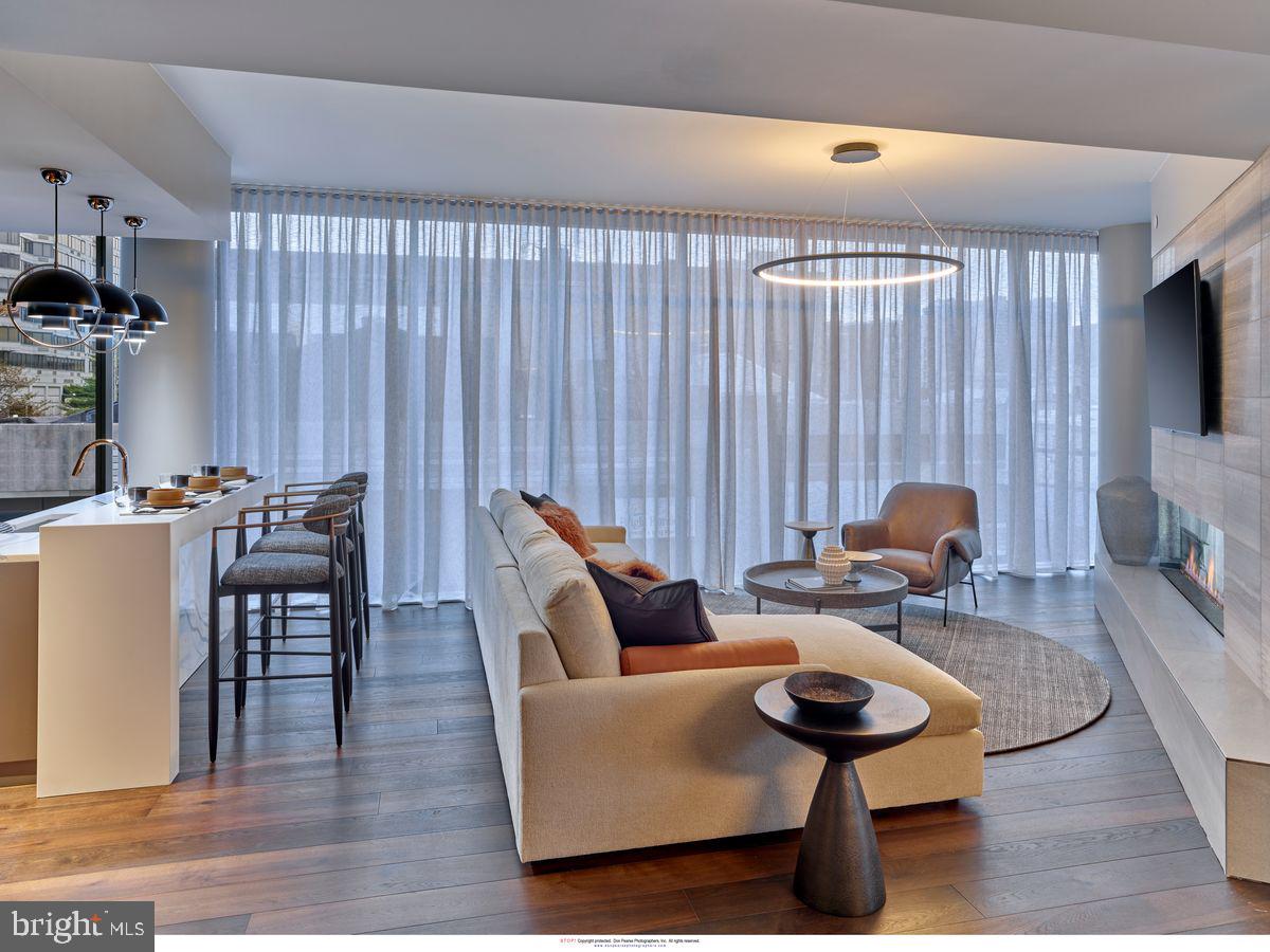 2100 Hamilton Street, Unit 9D Philadelphia, PA 19130 - Photo 13 of 24 a living room with furniture and a flat screen tv