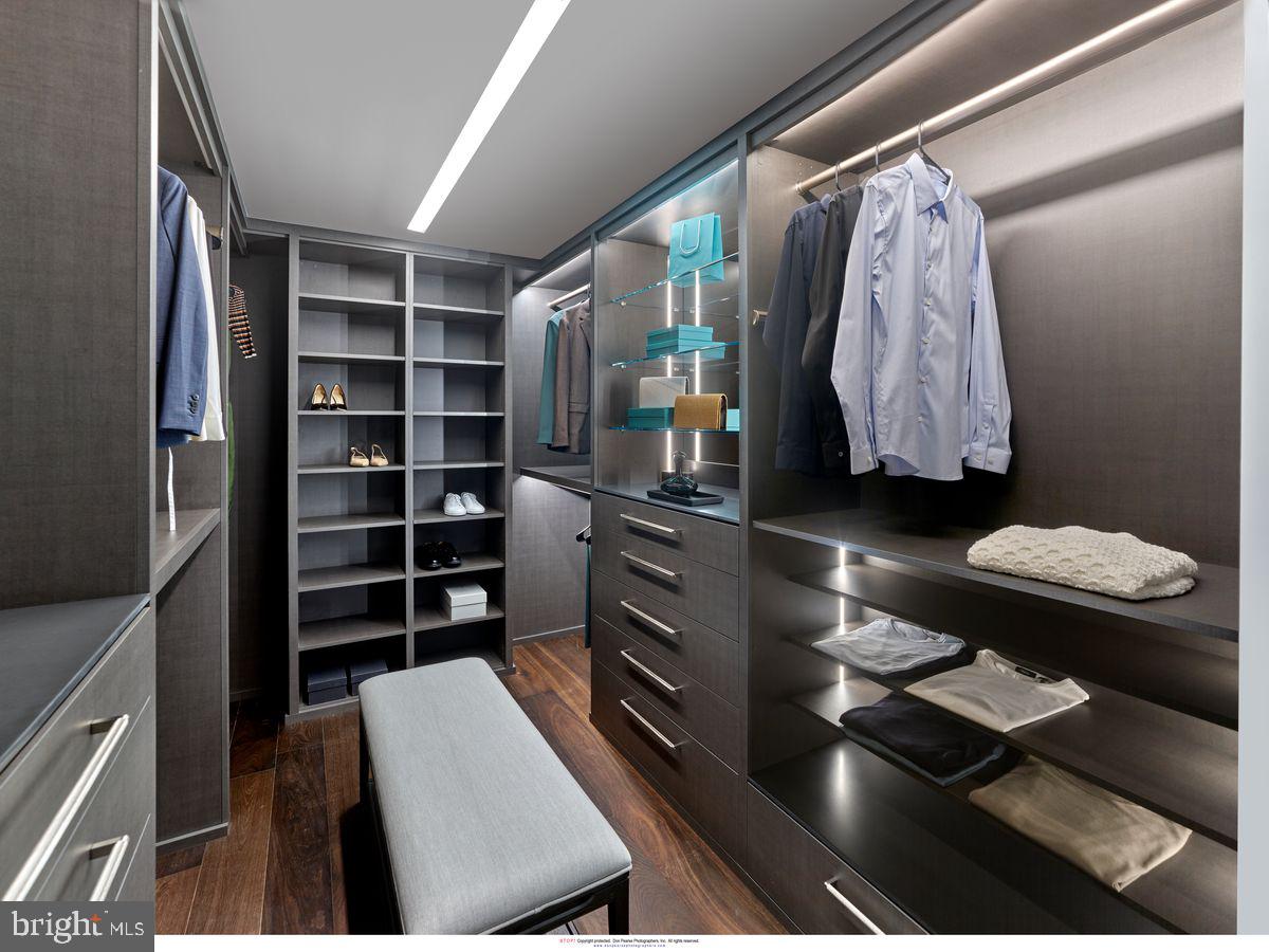 2100 Hamilton Street, Unit 9D Philadelphia, PA 19130 - Photo 16 of 24 a view of walk in closet with clothes and shoes