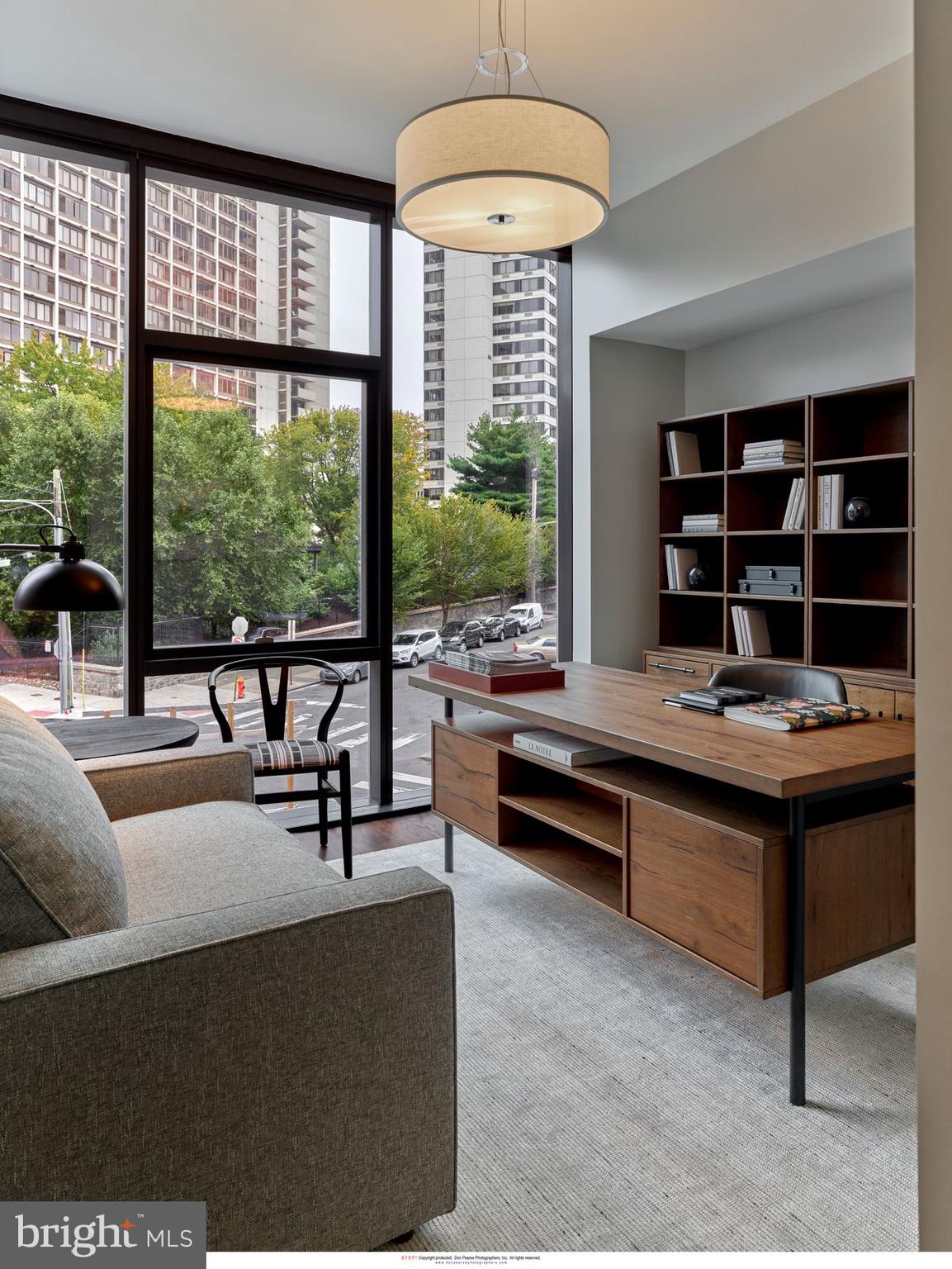 2100 Hamilton Street, Unit 9D Philadelphia, PA 19130 - Photo 19 of 24 a living room with furniture and a large window