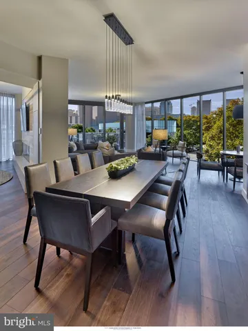 a living room with furniture and large windows