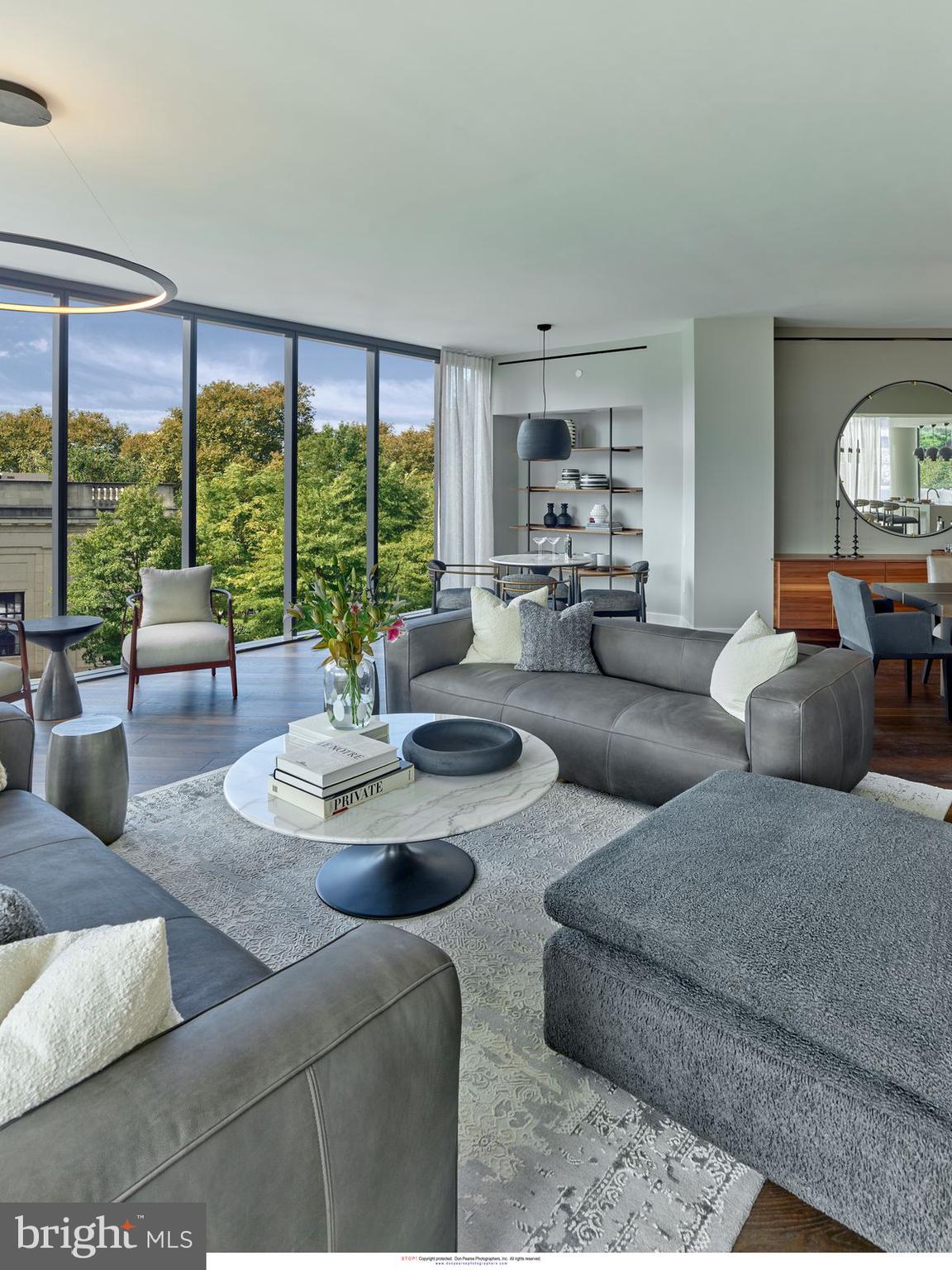 2100 Hamilton Street, Unit 9D Philadelphia, PA 19130 - Photo 23 of 24 a living room with furniture and large windows