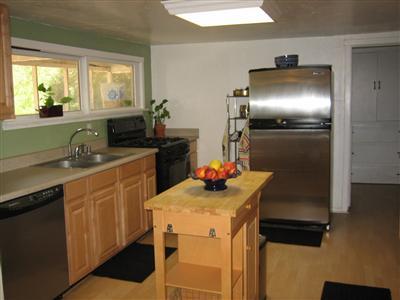 526 South Rice Road Ojai, CA 93023 - Photo 9 of 12 a kitchen with a sink and refrigerator