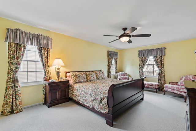 a bed room with a bed and a window