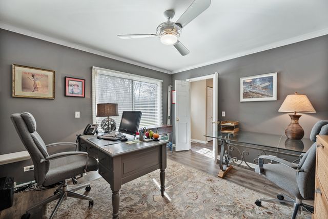 a work room with furniture and windows