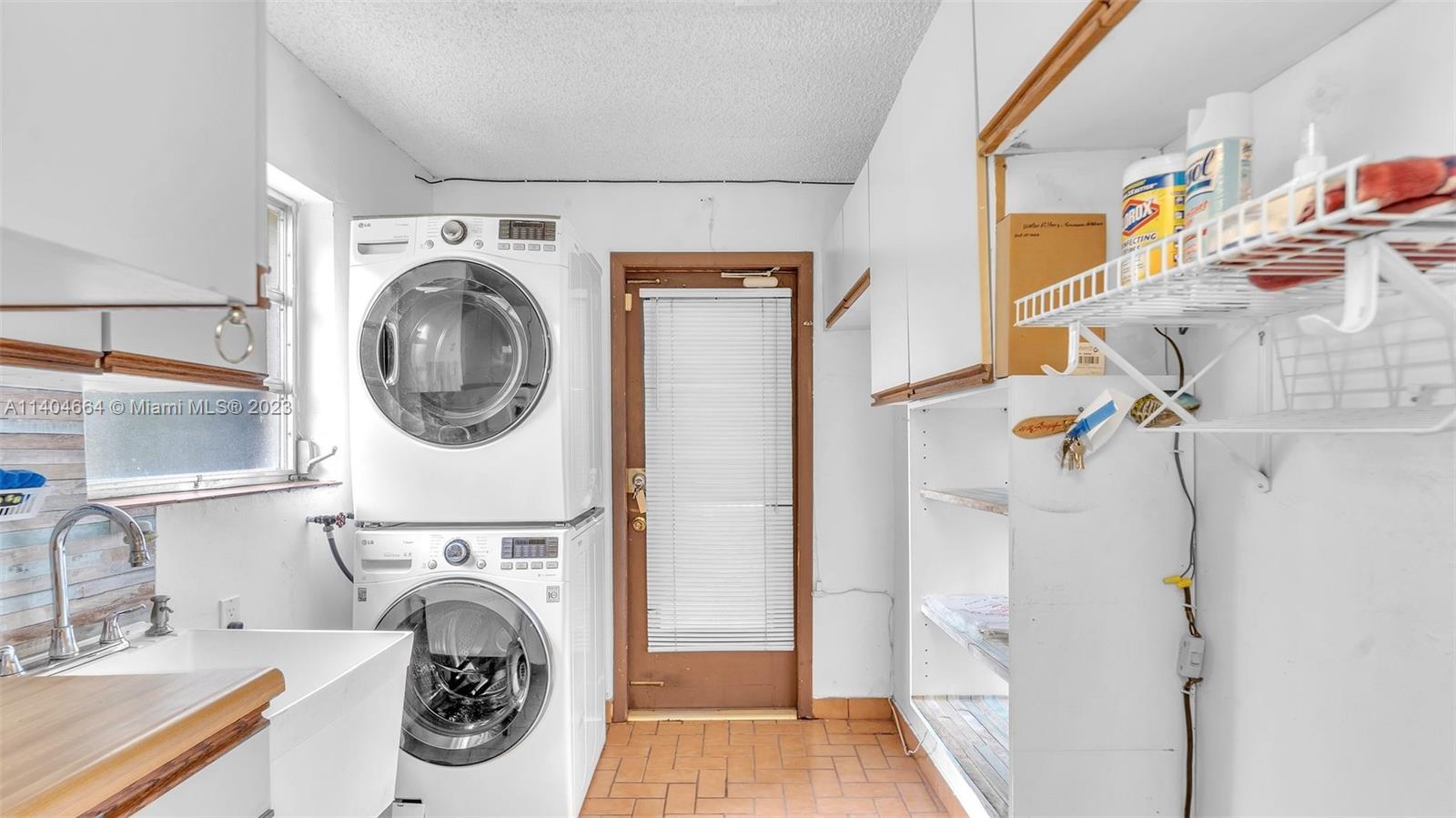3333 Southwest 1st Street Miami, FL 33135 - Photo 16 of 70 a utility room with dryer and washer