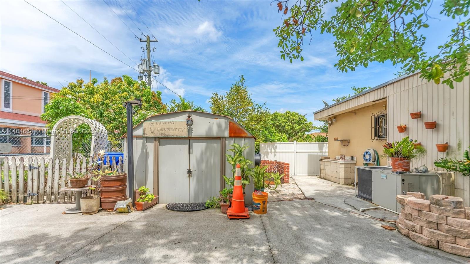 3333 Southwest 1st Street Miami, FL 33135 - Photo 19 of 70 a view of a chairs and table in the back yard of the house