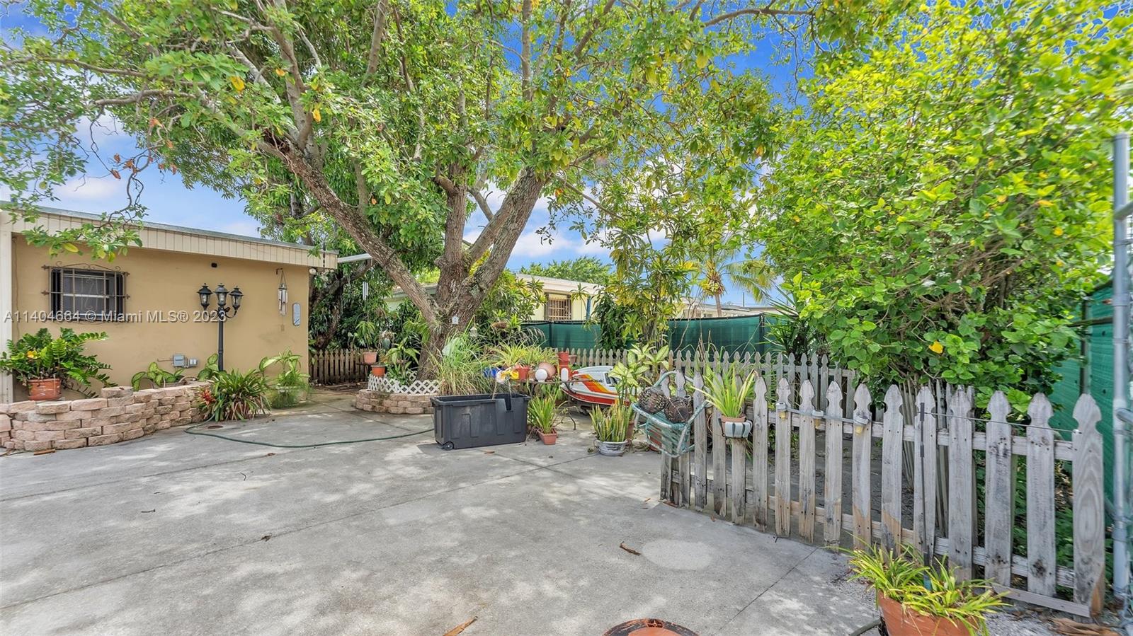 3333 Southwest 1st Street Miami, FL 33135 - Photo 20 of 70 a view of a dinning table and chairs in patio in front of house