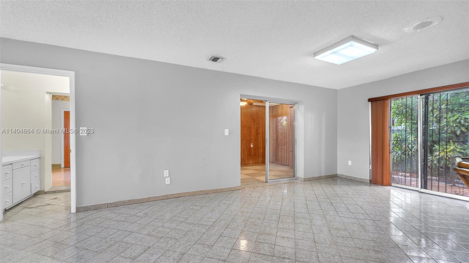 3333 Southwest 1st Street Miami, FL 33135 - Photo 31 of 70 an empty room with windows and entrance