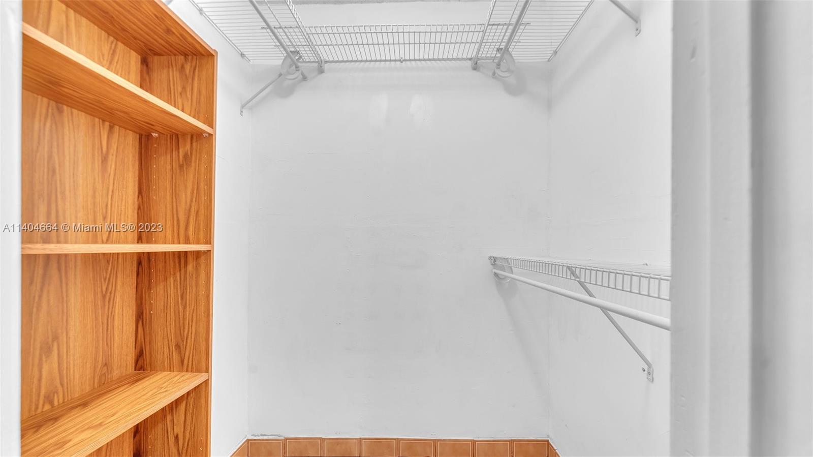 3333 Southwest 1st Street Miami, FL 33135 - Photo 34 of 70 a view of walk in closet with empty racks