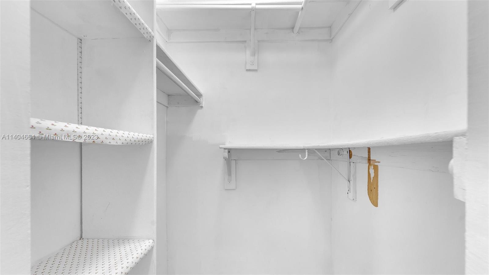 3333 Southwest 1st Street Miami, FL 33135 - Photo 41 of 70 a view of walk in closet with empty racks