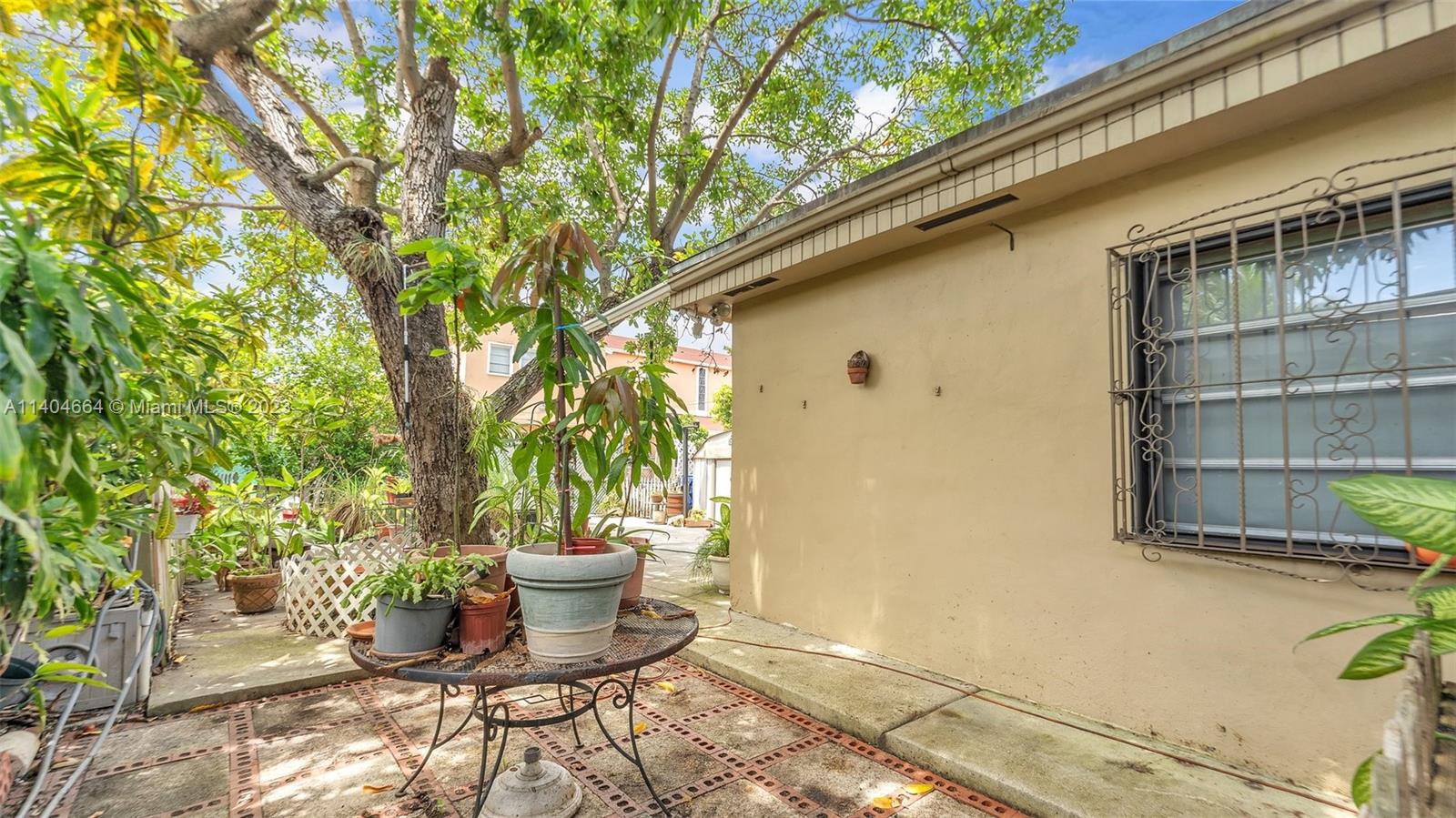 3333 Southwest 1st Street Miami, FL 33135 - Photo 60 of 70 a view of a porch with a potted plants and a fountain