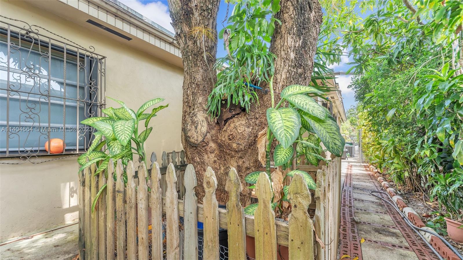 3333 Southwest 1st Street Miami, FL 33135 - Photo 62 of 70 a vase of flowers sitting on a wooden floor