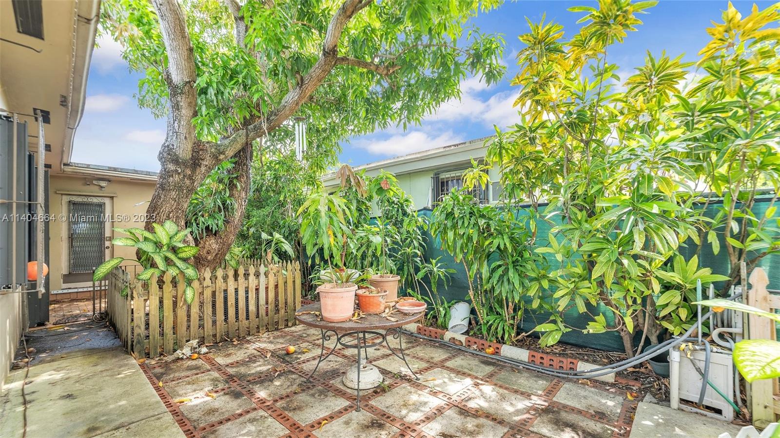 3333 Southwest 1st Street Miami, FL 33135 - Photo 65 of 70 a view of a house with a small yard and plants