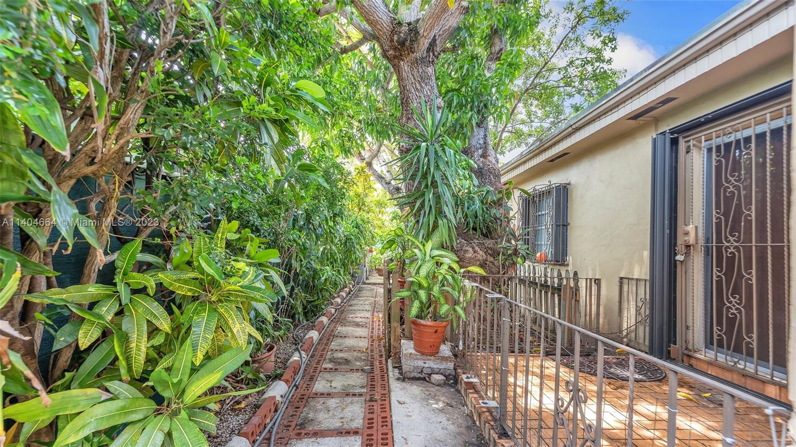 3333 Southwest 1st Street Miami, FL 33135 - Photo 67 of 70 a house with a tree in front of it