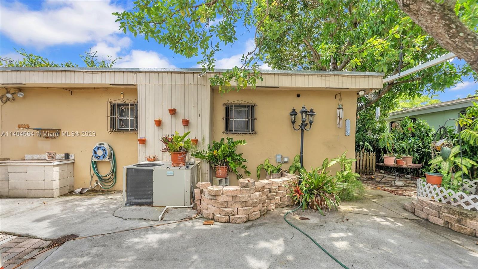 3333 Southwest 1st Street Miami, FL 33135 - Photo 68 of 70 a view of a house with potted plants