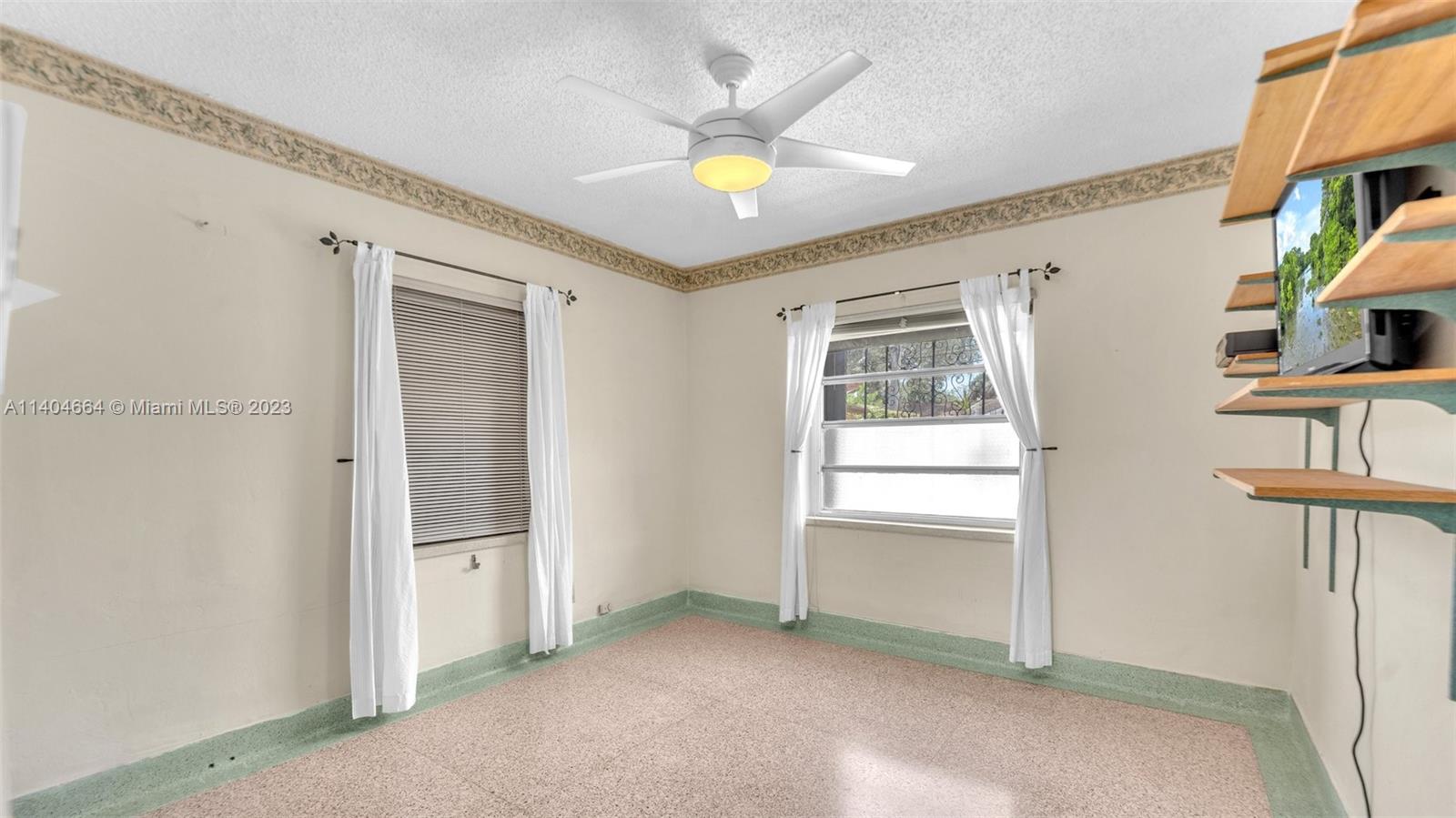 3333 Southwest 1st Street Miami, FL 33135 - Photo 9 of 70 a view of an empty room with a window