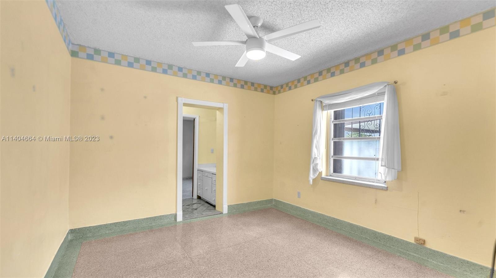 3333 Southwest 1st Street Miami, FL 33135 - Photo 10 of 70 a view of an empty room with a window