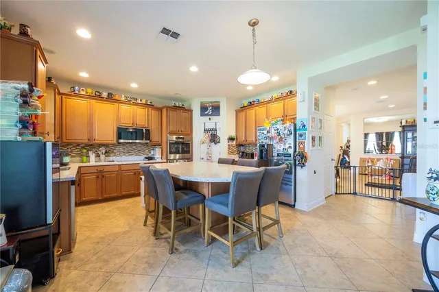 a large bathroom with a double vanity sink mirror and bathtub