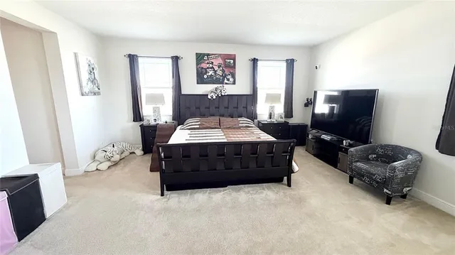 a view of an empty room and a bathroom