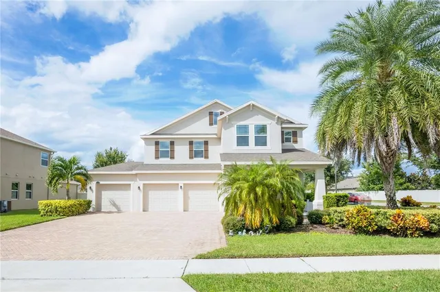 a front view of house with yard and green space