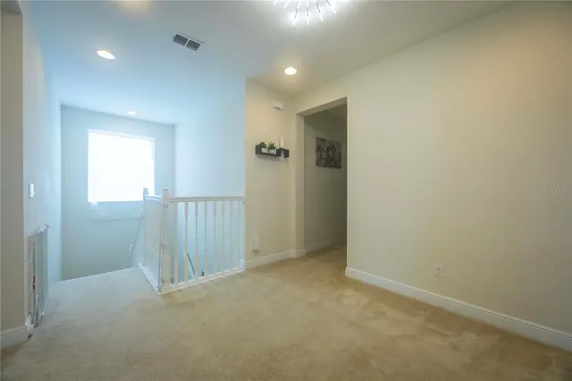 a view of a dining room with furniture and window