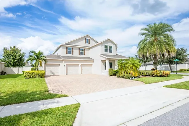 an aerial view of a house with a garden